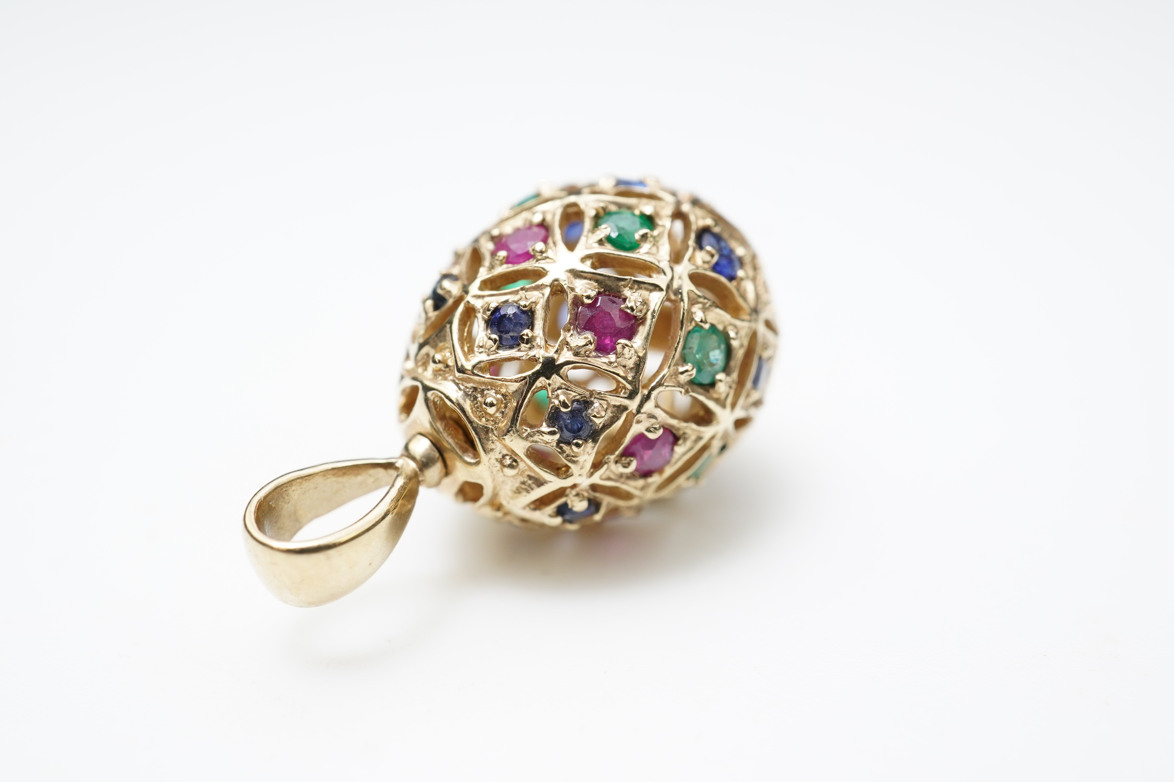 A gem-set egg pendant and an Edwardian seed pearl pendant